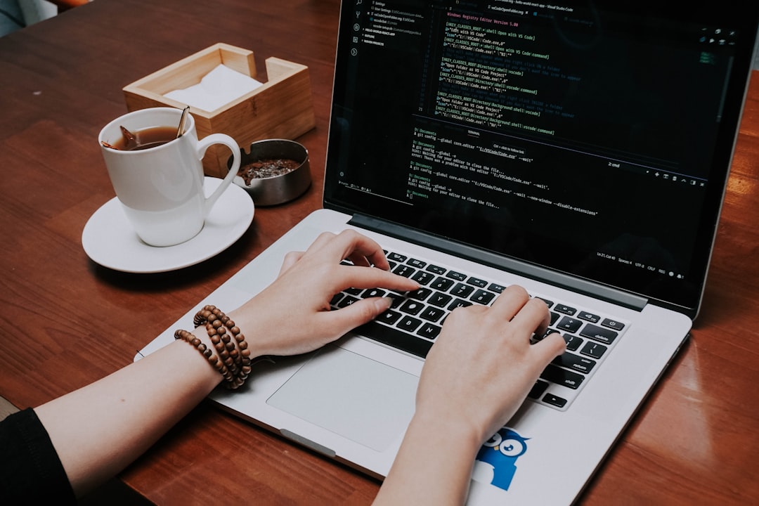 developer using laptop coding